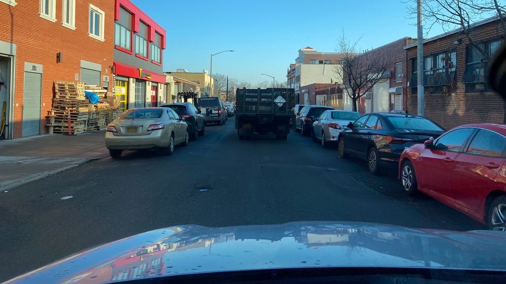 Street-level daytime example from Astoria Nyc, cropped to show the local street context.