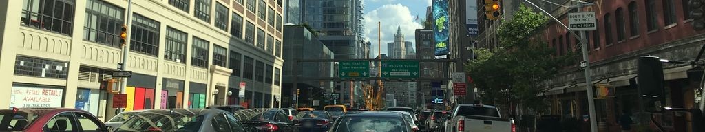 Street-level low light example from Downtown Manhattan Nyc, cropped to the local street backdrop.