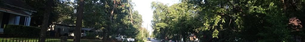 Street-level low light example from East Austin, cropped to the local street backdrop.