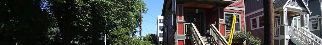 Street-level low light example from Portland Central Eastside, cropped to the local street backdrop.