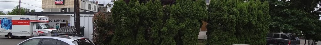 Street-level low light example from Portland East 82Nd, cropped to the local street backdrop.