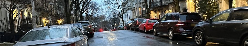 Street-level low light example from Upper West Side Nyc, cropped to the local street backdrop.
