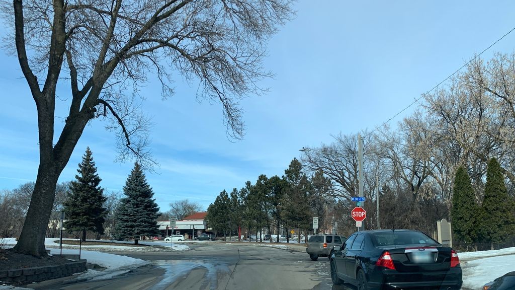 Street-level daytime example from Uptown Chain Of Lakes Minneapolis, cropped to show the local street context.